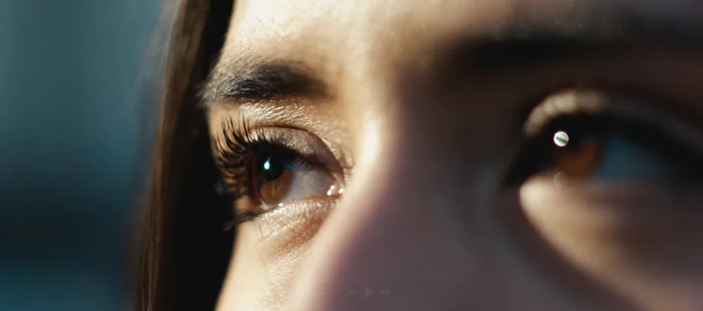Cinematic close-up of a child’s eyes