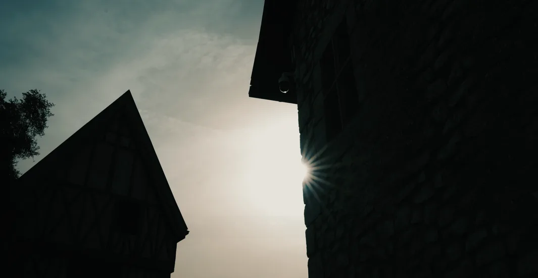 Architecture silhouetted against sunlight